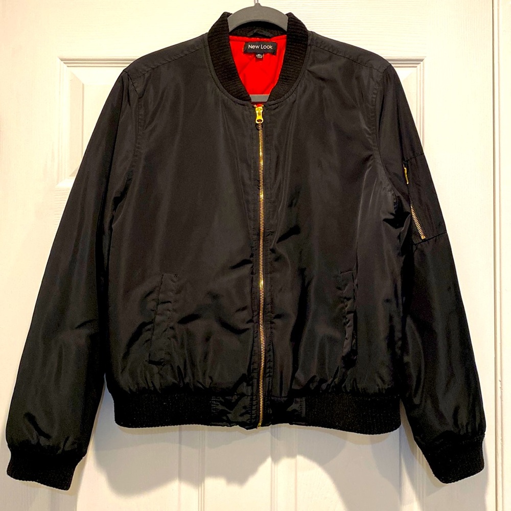 Black bomber jacket with orange lining
